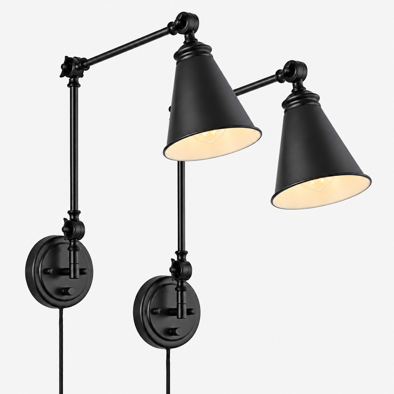 Pair of black iron swing-arm sconces with cone shades