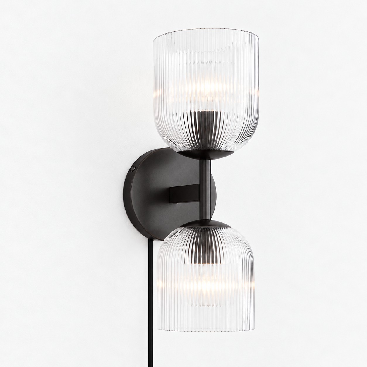 Black ribbed-glass wall sconce, two lights