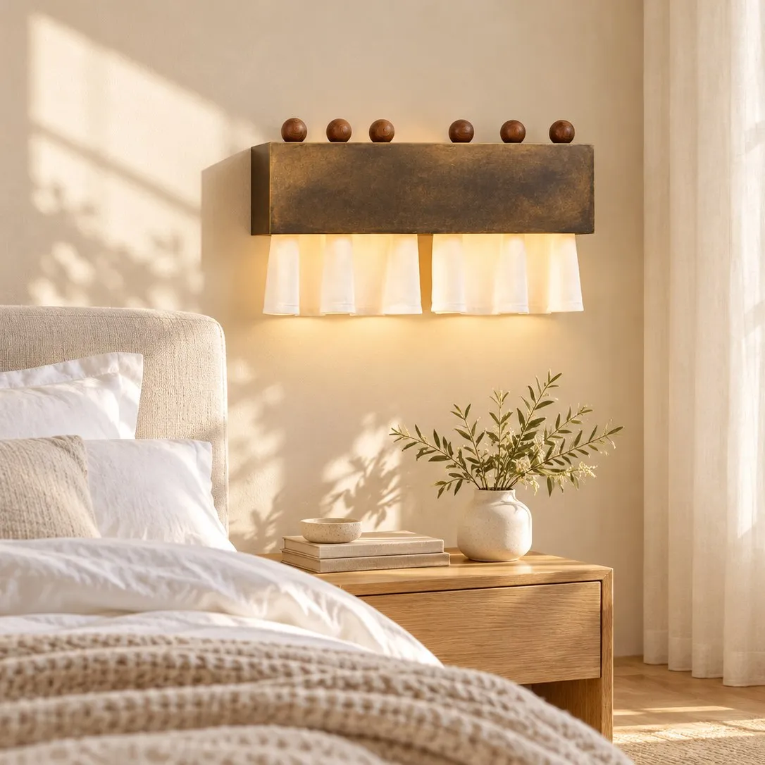 Dark antique bronze curtain wall lamp in a bright bedroom